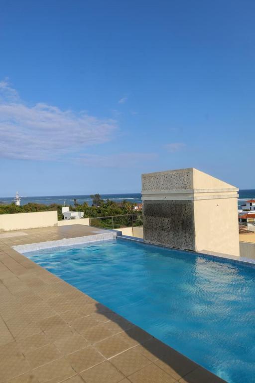 a swimming pool on top of a building at C Waves Palm Terraces in Mombasa