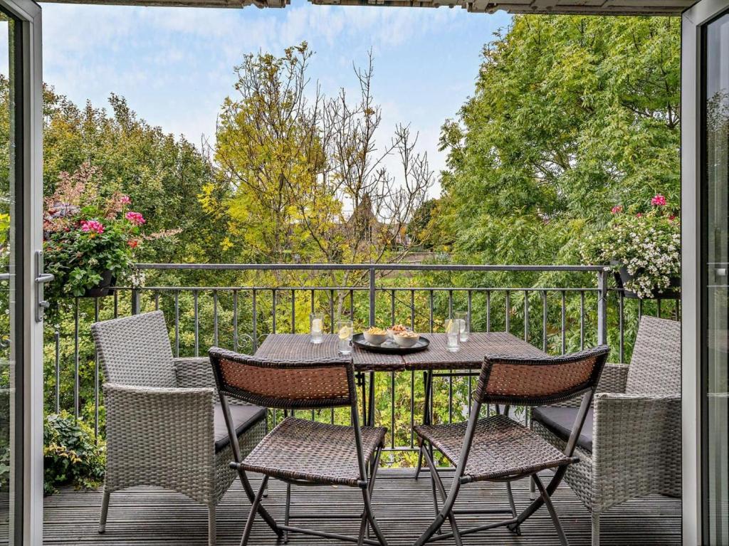 a patio with a table and chairs on a balcony at 2 Bed in Brecon oc-bn140 in Brecon