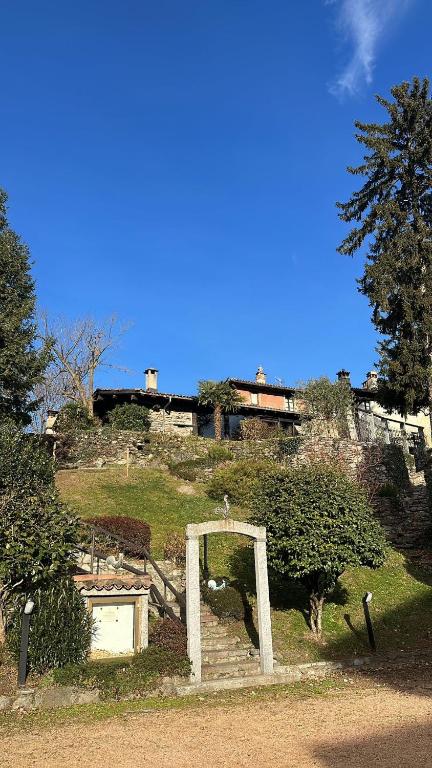 a building sitting on top of a hill with stairs at Locanda Motto del Gallo in Taverne