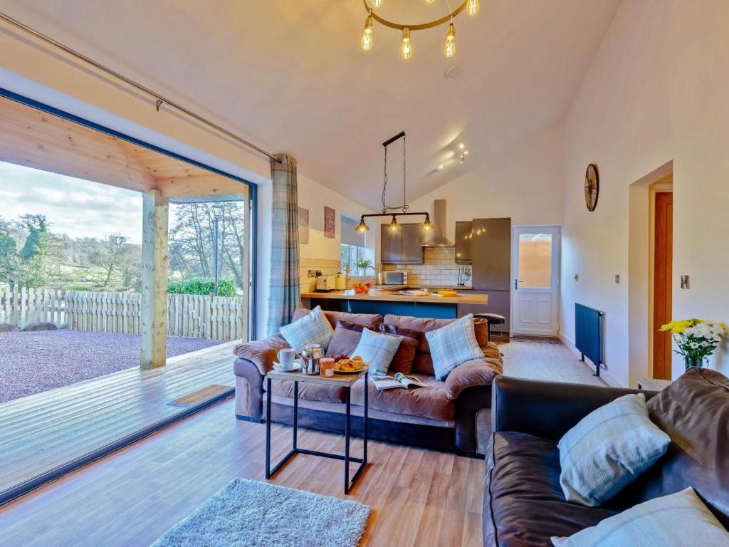a living room with a couch and a table at 2 Bed in Bridgnorth oc-77721 in Highley