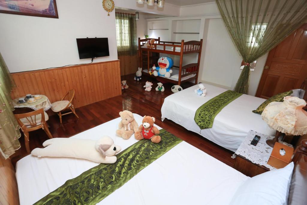 Postel nebo postele na pokoji v ubytování Yilan Homeland B&B