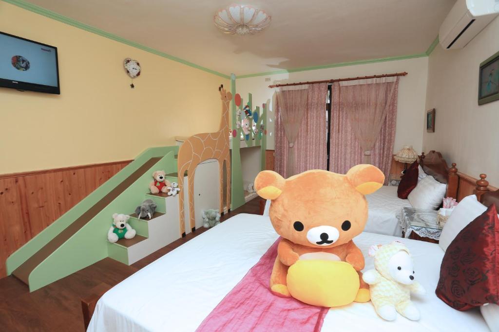 Postel nebo postele na pokoji v ubytování Yilan Homeland B&B
