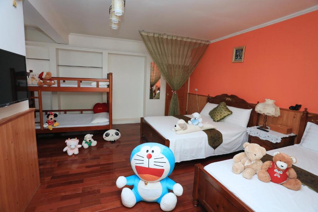 Postel nebo postele na pokoji v ubytování Yilan Homeland B&B
