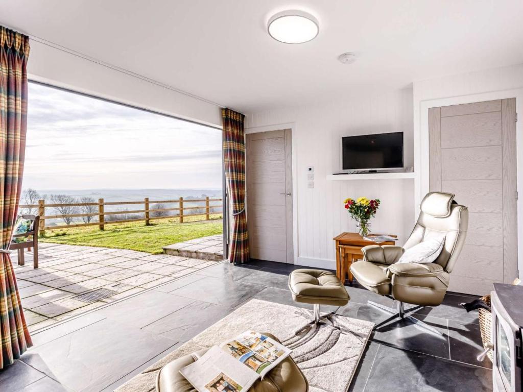 a living room with a view of the ocean at 1 Bed in Barnstaple oc-77349 in Loxhore
