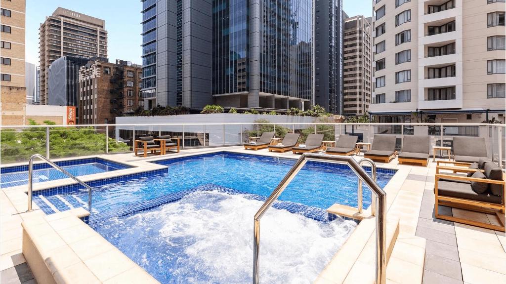 a hot tub on the roof of a building at CITY Centre With Awesome Views! in Brisbane