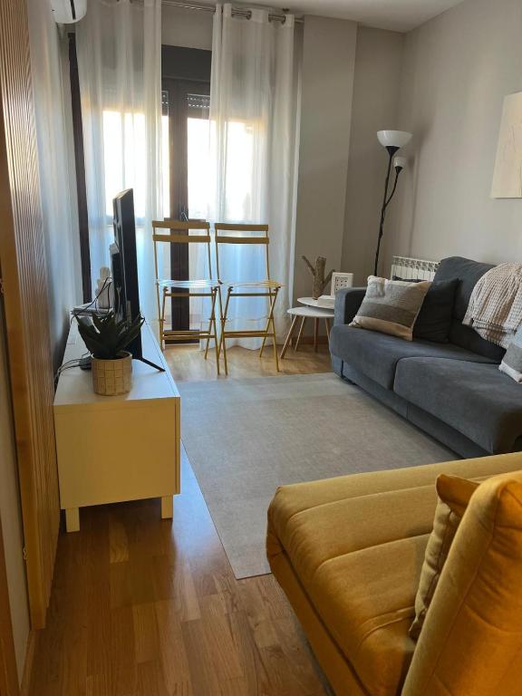 a living room with a couch and a table at Real 92 in Arguedas
