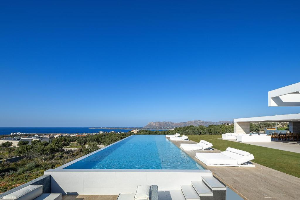 a view of the infinity pool of a villa at Oliva D'oro Villa - Sunset Gaze by etouri in Chania