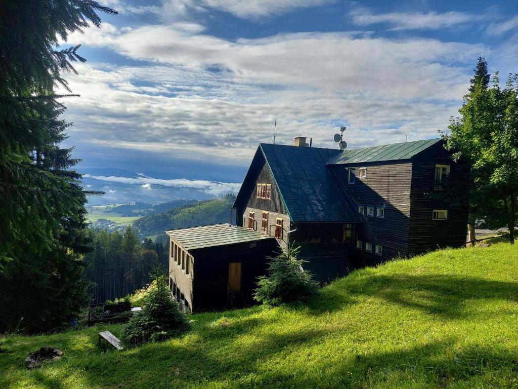 a barn on the side of a hill at Chata Návrší in Stříbrnice