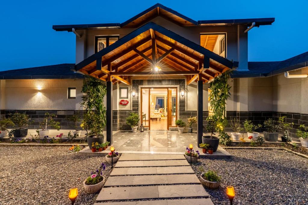 a house with a pathway leading to the front door at Summerfield Manor 5 Bedroom Garden Estate in Bhīm Tāl