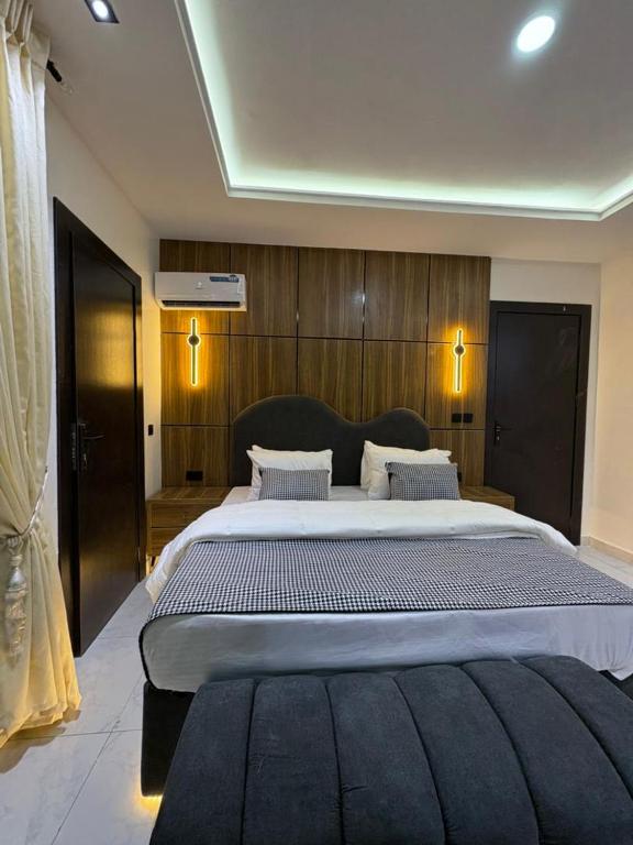 a large bedroom with a large bed in a room at JKB APARTMENt in Lekki