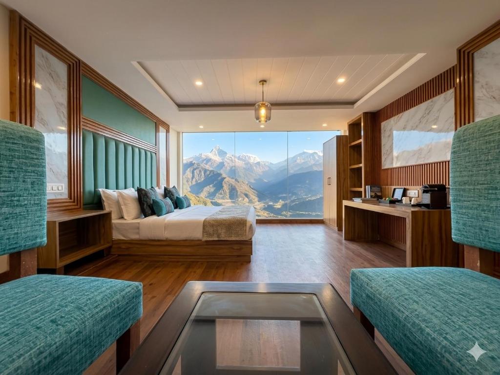 a bedroom with a bed and a view of a mountain at The Hamilton Valley View, Koti - A Beautiful Resort in Cloud's in Shimla