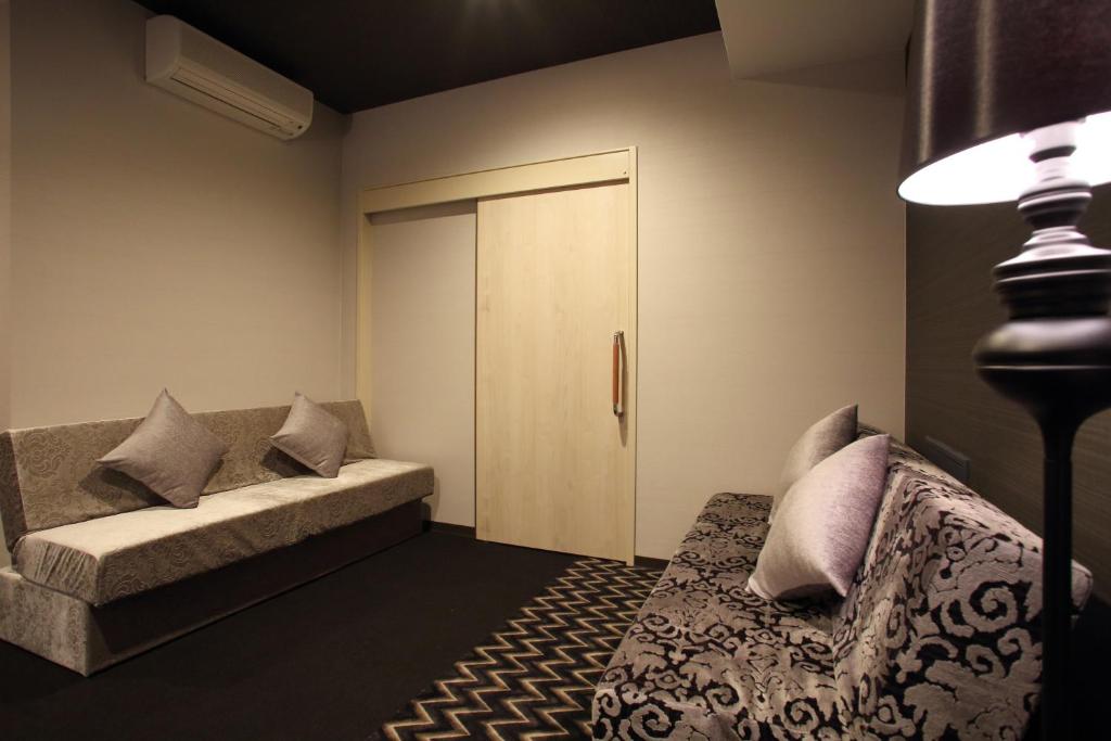 Postel nebo postele na pokoji v ubytování Centurion Hotel Grand Kobe Station