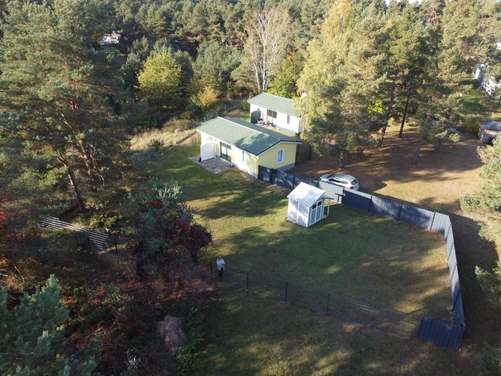 an aerial view of a house with a yard at Hundeparadies "Bodden Paradise Cottage" in Pruchten