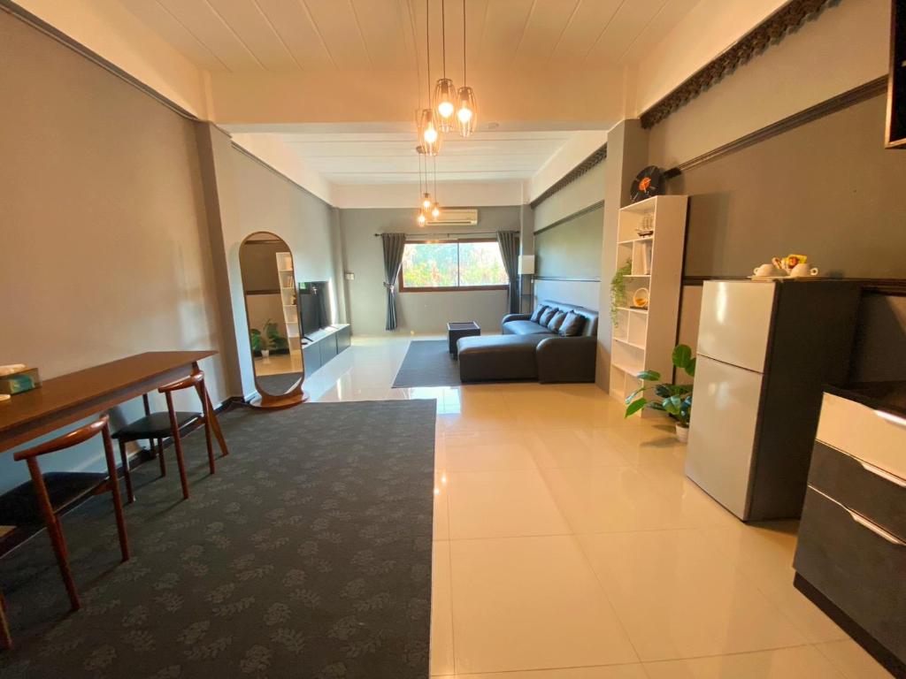 a living room with a couch and a table at Vera House in North Pattaya
