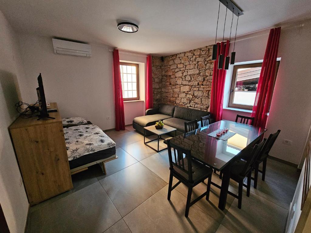 a living room with a table and a couch at Mark & Lana in Sežana