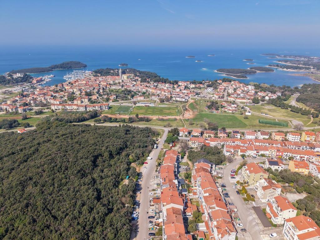 an aerial view of a city and the ocean at Milankovic Apartments in Vrsar