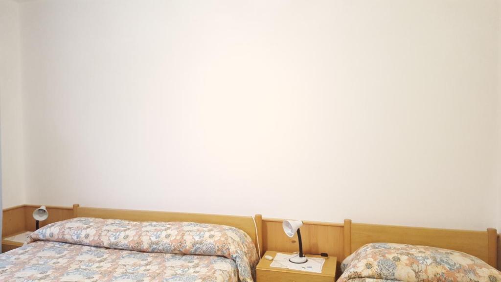 Postel nebo postele na pokoji v ubytování Cèsa Silvano