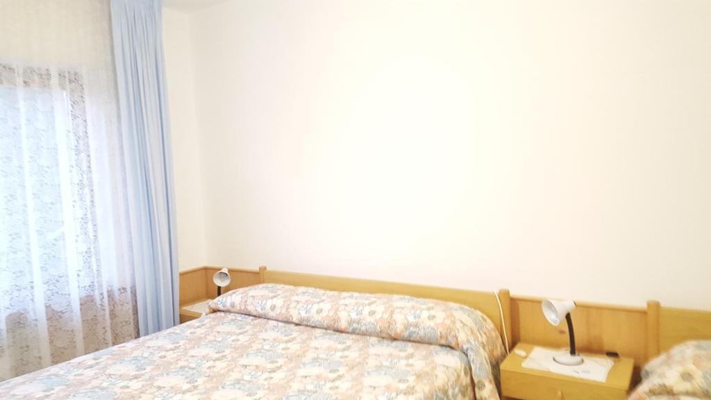 Postel nebo postele na pokoji v ubytování Cèsa Silvano