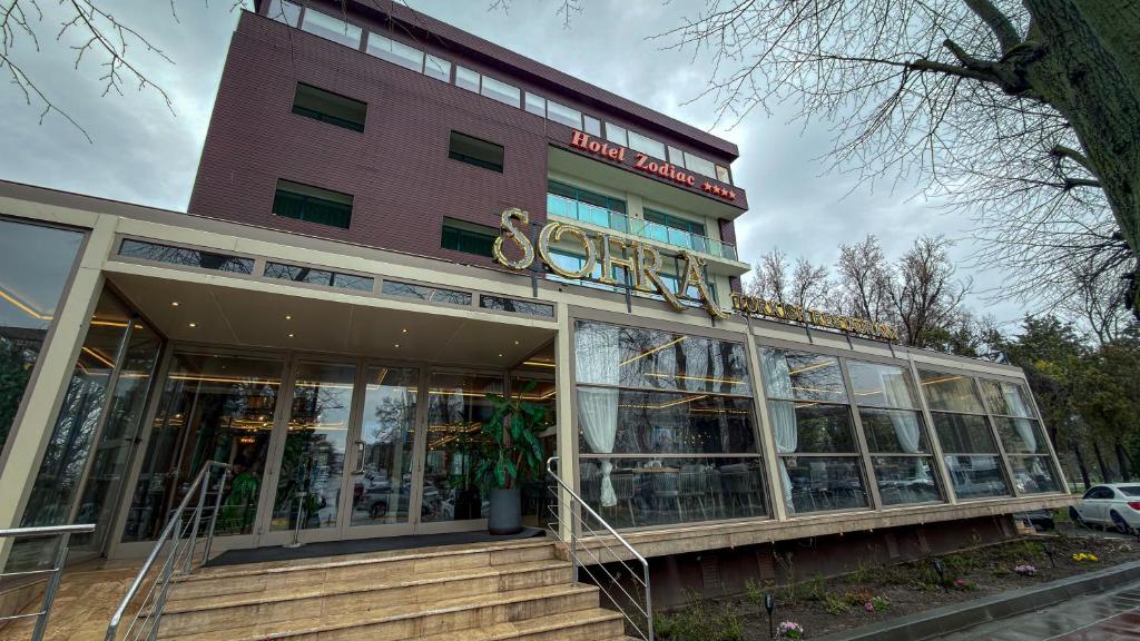 a building with a sign on top of it at Hotel Zodiac by Sofra in Constanţa