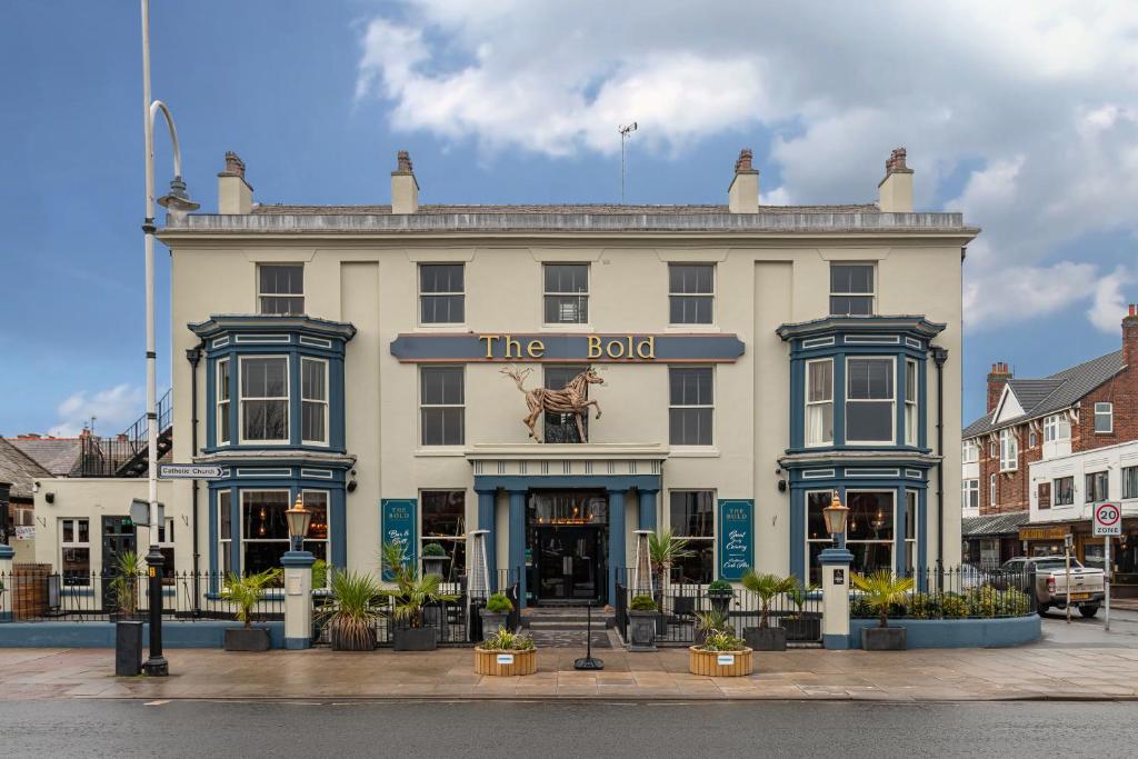a large white building with a sign on it at The Bold Hotel; BW Signature Collection in Southport