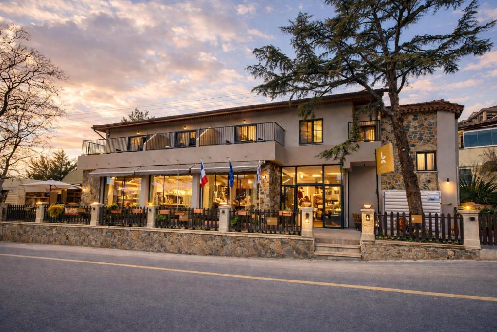 a building with a lot of windows at Kallithea INN in Platres