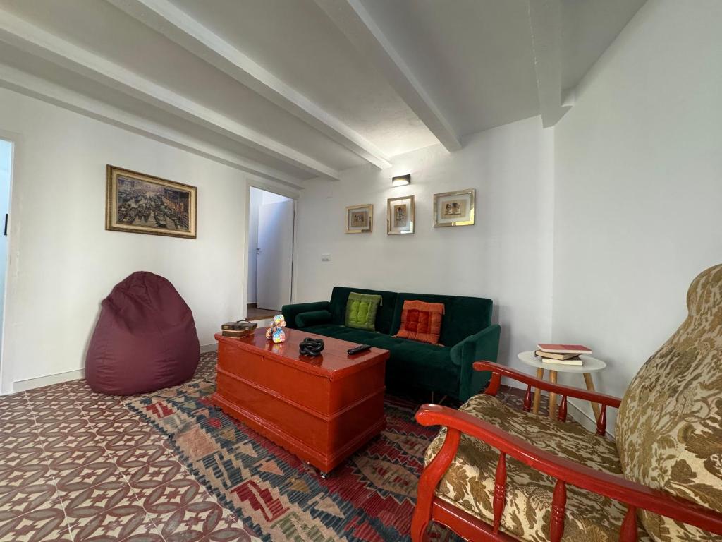 a living room with a couch and a table at Casa Lui Codrut in Alcalà de Xivert