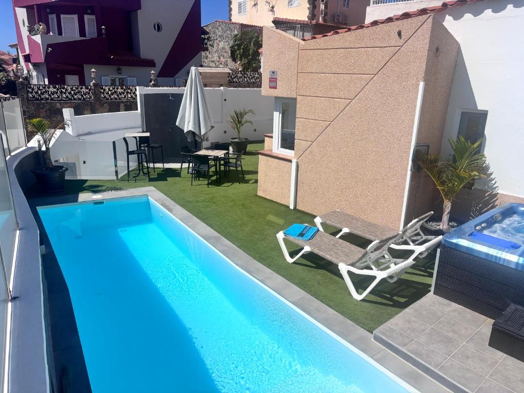 a pool on the roof of a house at ViLLA DANEIRA LUX in Mogán