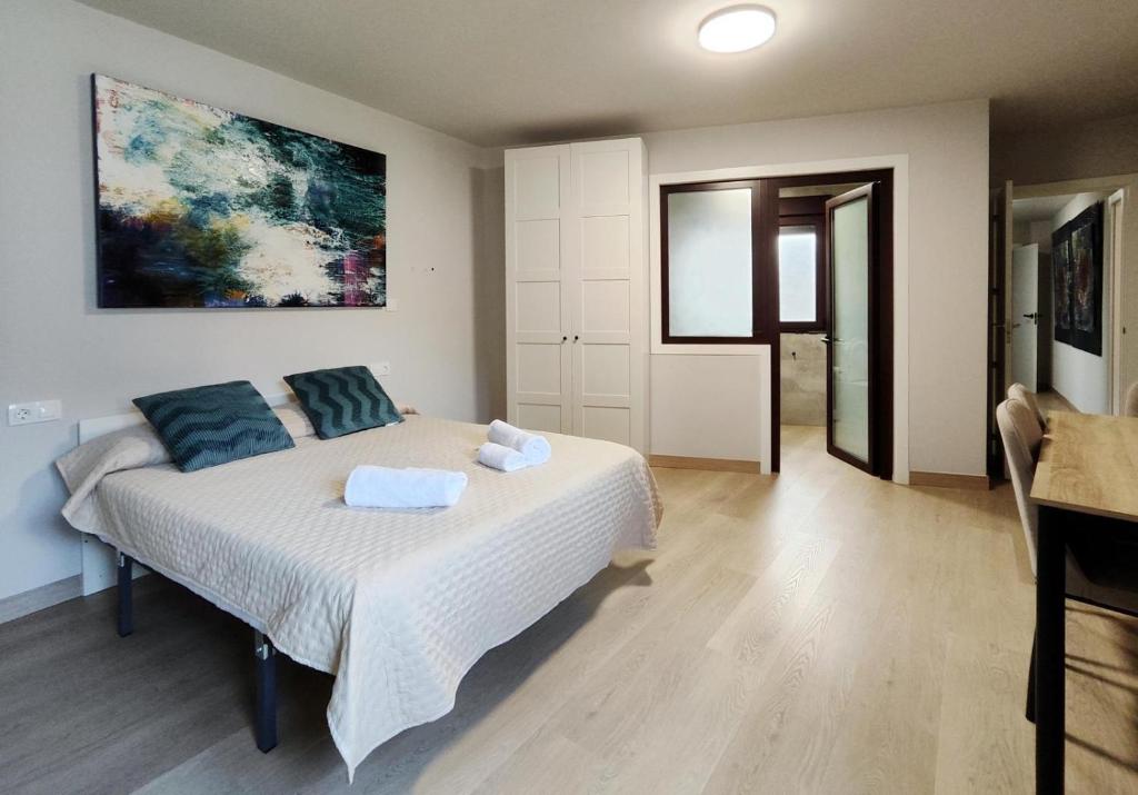 a bedroom with a bed with two pillows on it at Premium Luxury Muralla de Lugo 2.3-A in Lugo