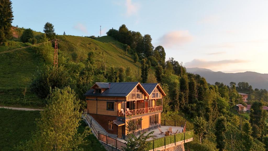 an aerial view of a house on a hill at Pisa Villa-Bungalov in Topluca