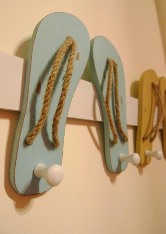 a pair of ear hooks hanging on a wall at Knock Knock Hostel in Kaohsiung