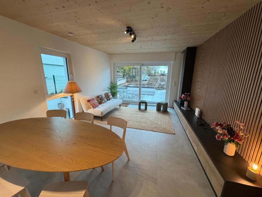 a living room with a table and a couch at NEW - Mullerthal Basecamp - Sleeps 6 in Beaufort