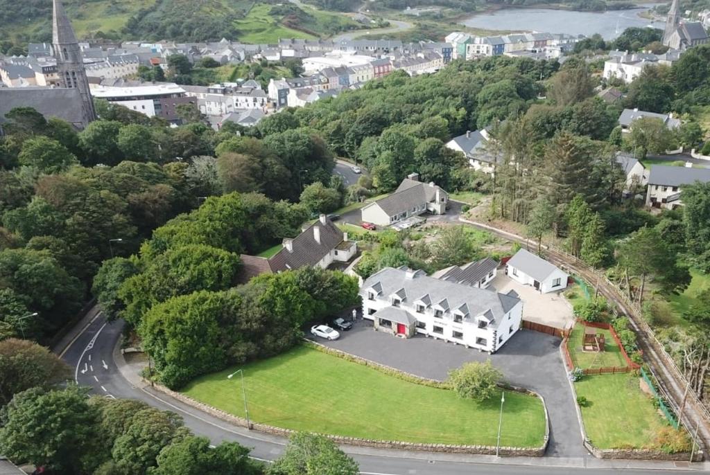 an aerial view of a house with a driveway at Benbaun House in Clifden