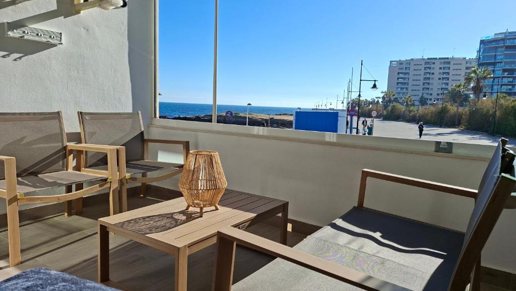 Stylish Frontline Punta Prima Suite with Sea Views