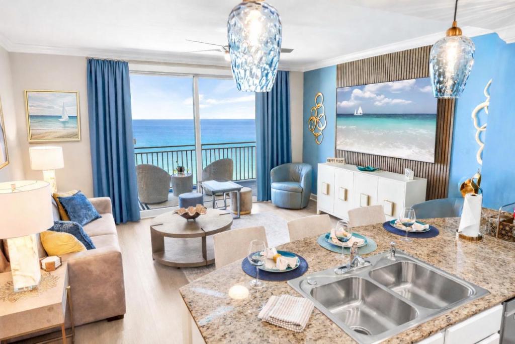 a living room with a view of the ocean at Splash Resort Luxury Pools Lazy River Water Parks Sept still Available in Panama City Beach
