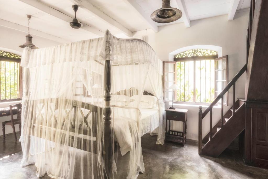 Postel nebo postele na pokoji v ubytování Nisala Arana Boutique Hotel