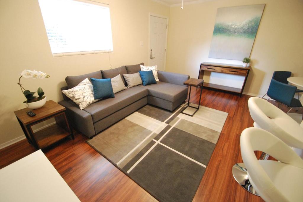 a living room with a couch and a table at Stylish Austin Condo in Austin