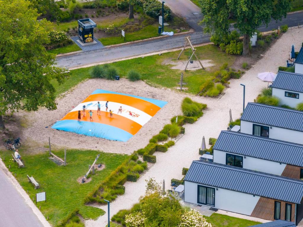 an overhead view of a beach with an umbrella at EuroParcs Kaatsheuvel in Kaatsheuvel