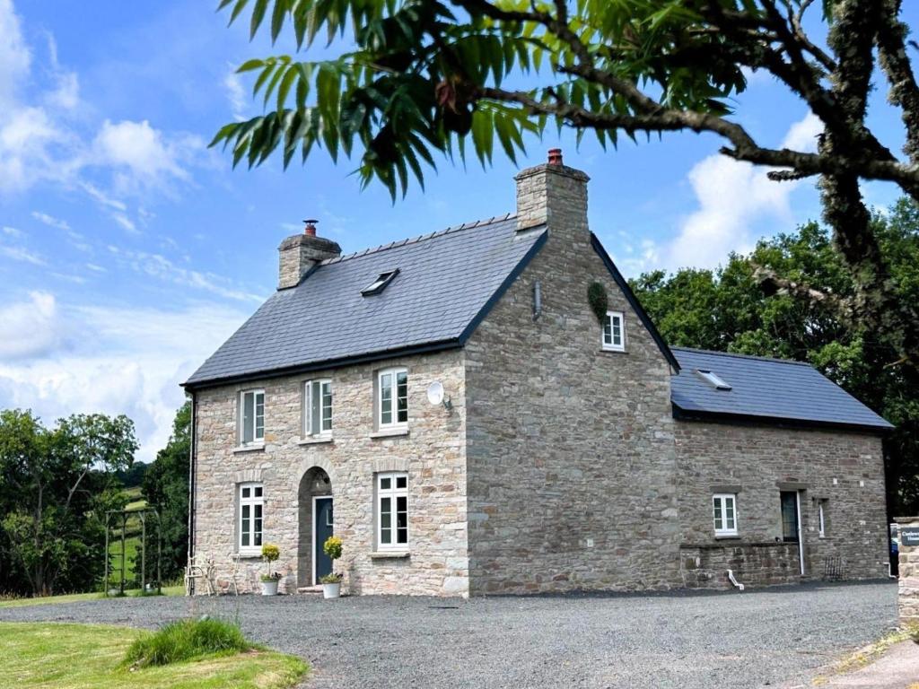 an old stone house with a grey roof at 3 Bed in Brecon oc-93680 in Llandefalle