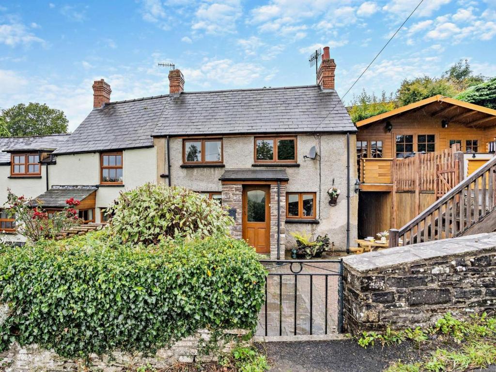 a house with a gate and a fence at 2 Bed in Brecon oc-bn138 in Bwlch