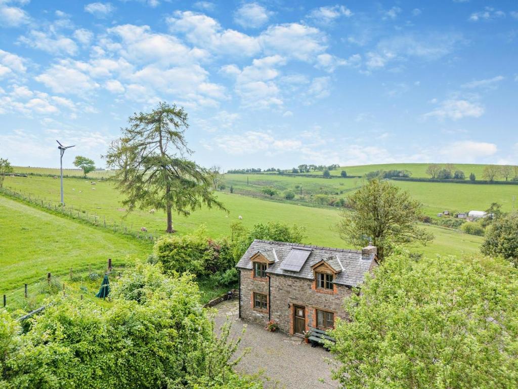 an aerial view of a stone house in a field at 2 Bed in Craven Arms oc-95107 in Kerry