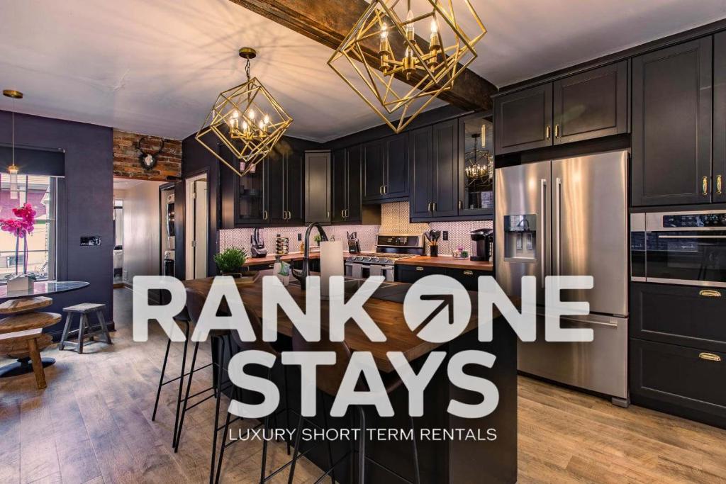 a rendering of a kitchen with a panic one stays banner at King Bed / Free Parking / BBQ / Fire pit / Arcade in Pittsburgh