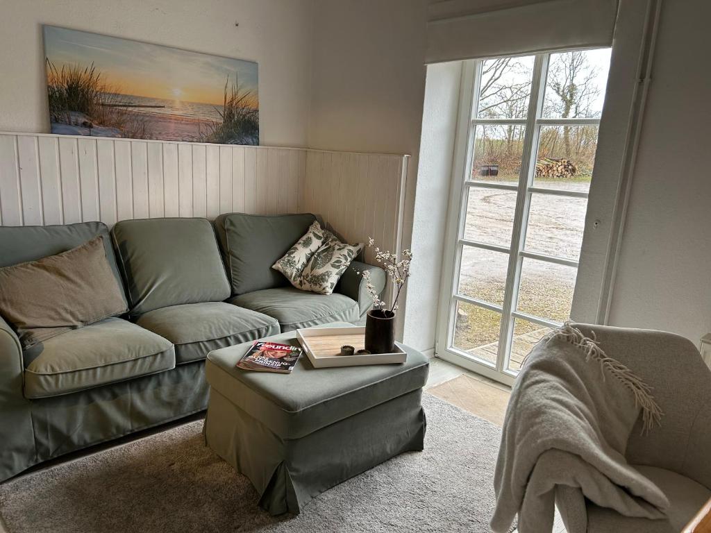 a living room with a couch and a coffee table at Ferienwohnung 1 Hof Flüh in Klenzau