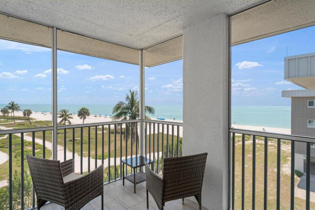 a view of the beach from the balcony of a condo at Island Beach Club #P3E in Ybel
