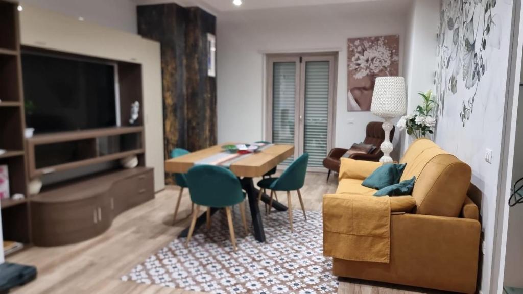 a living room with a couch and a table at Suite Vittoria in Ortona