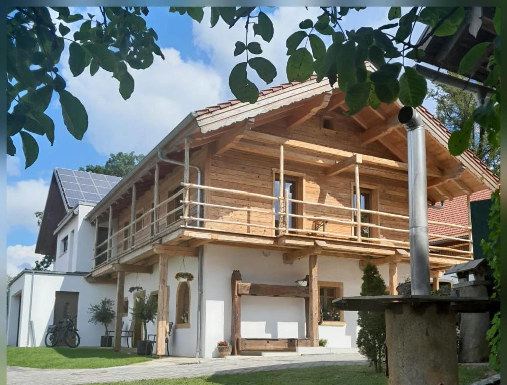 a house under construction with a porch and deck at Ferienhaus Träglhof in Hirschau