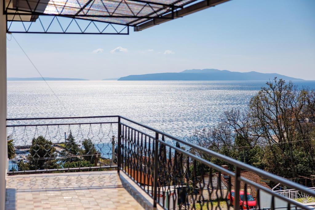 a view of the water from a balcony at Maestro Apartments Ičići Opatija Riviera in Ičići