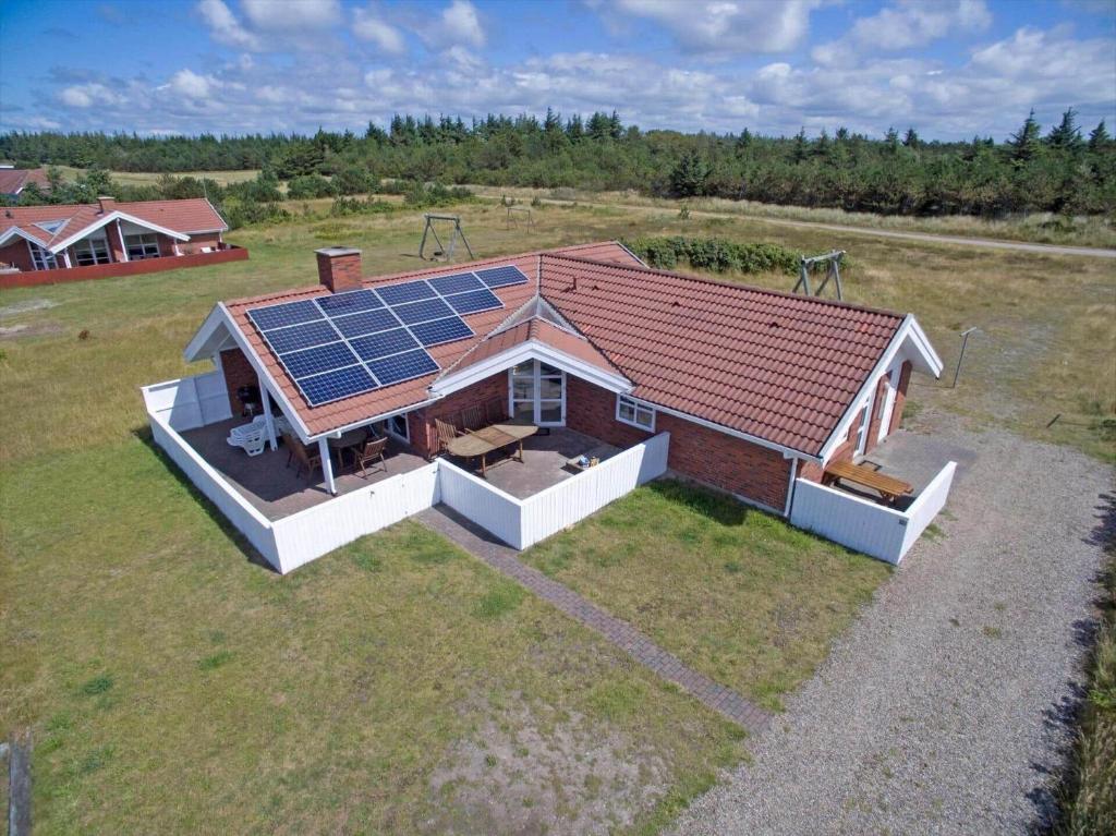 an overhead view of a house with solar panels on the roof at VE264-Vejers-Strand-Jafdalvej-95 in Vejers Strand