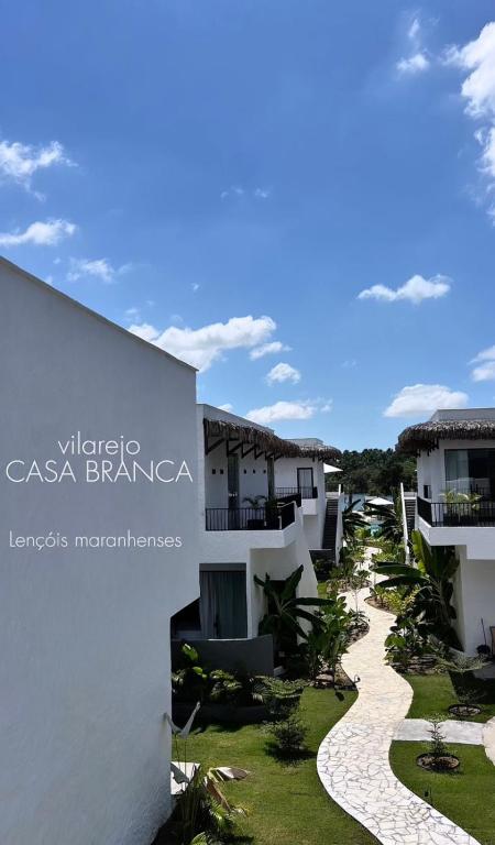a sign for the casa banderas resort at Vilarejo Casa Branca in Barreirinhas