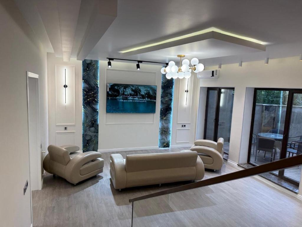 a living room with a couch and chairs at Modern Villa in Quba City Center in Quba
