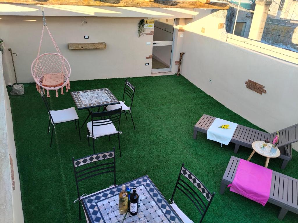 an overhead view of a patio with a table and chairs at CASA DEL CORSO in Dorgali